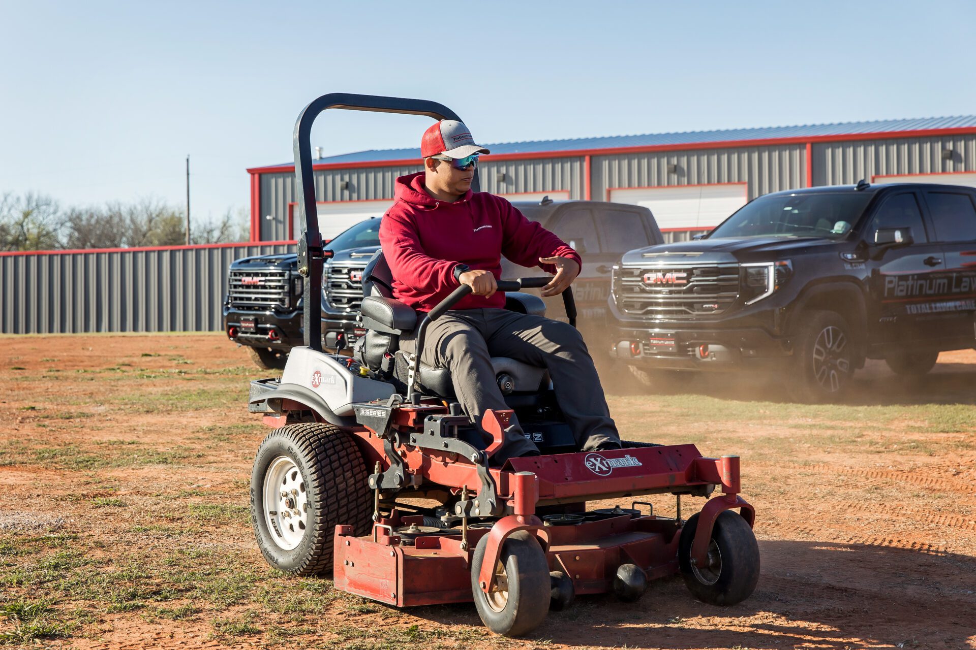 IMG_0460 a person driving a lawn mower