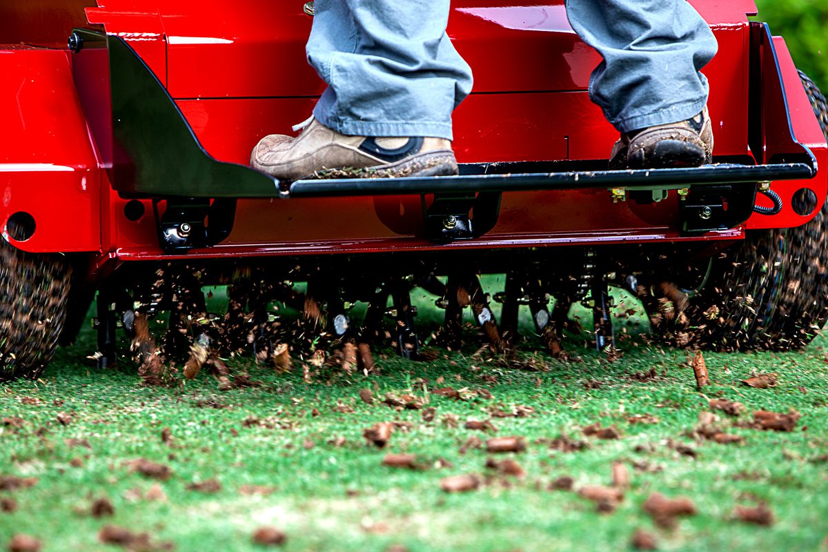 a person driving a lawn mower